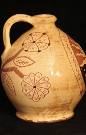 about today redware sun and moon jug side