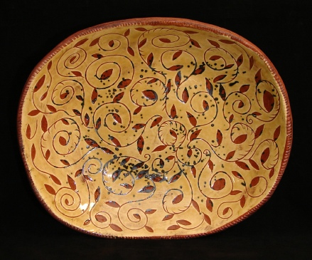 redware charger, ivy leaves