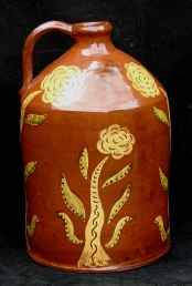 redware gallon jug, cat and trees