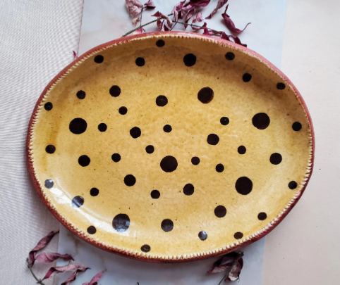 redware oval platter with black polka dots by Kulina Folk Art