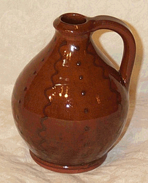 Black on Red Squiggles and Dots Redware, Watkins Jug